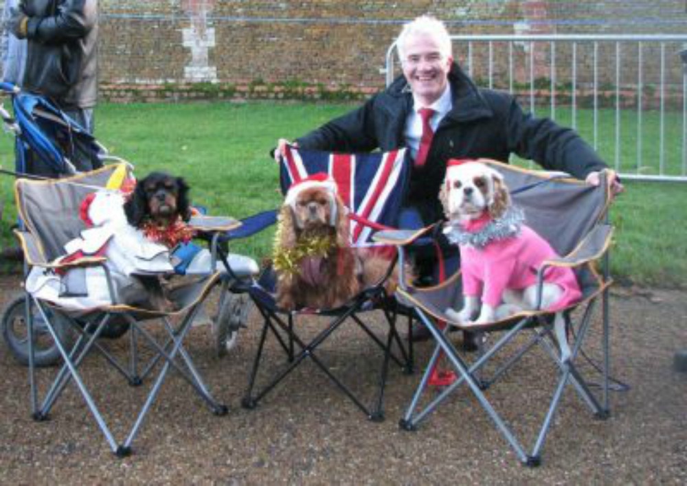 3 King Charles Cavaliers Spaniels outside the church at Sandringham on Christmas day